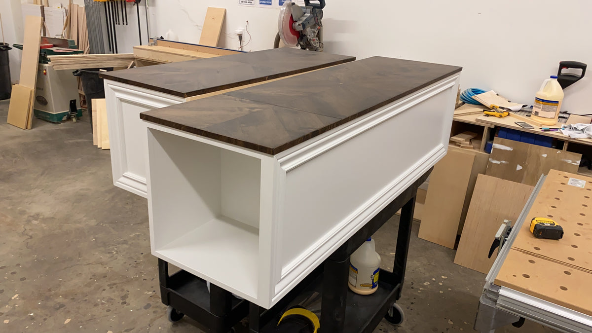 Photo of a Chevron style straight bench with a large open cubbie built into the left side end.