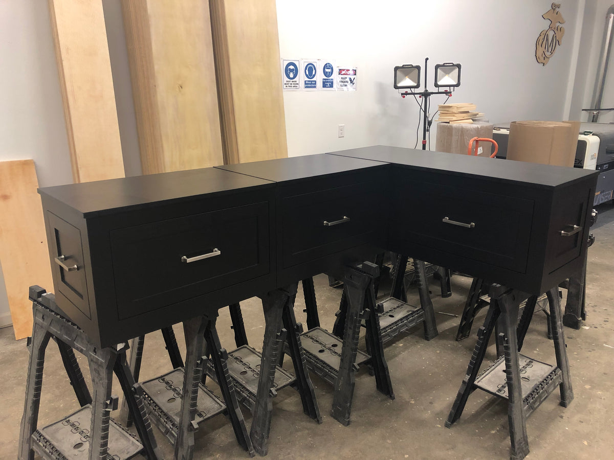 Photo of Shaker style L-shape corner bench painted all black.