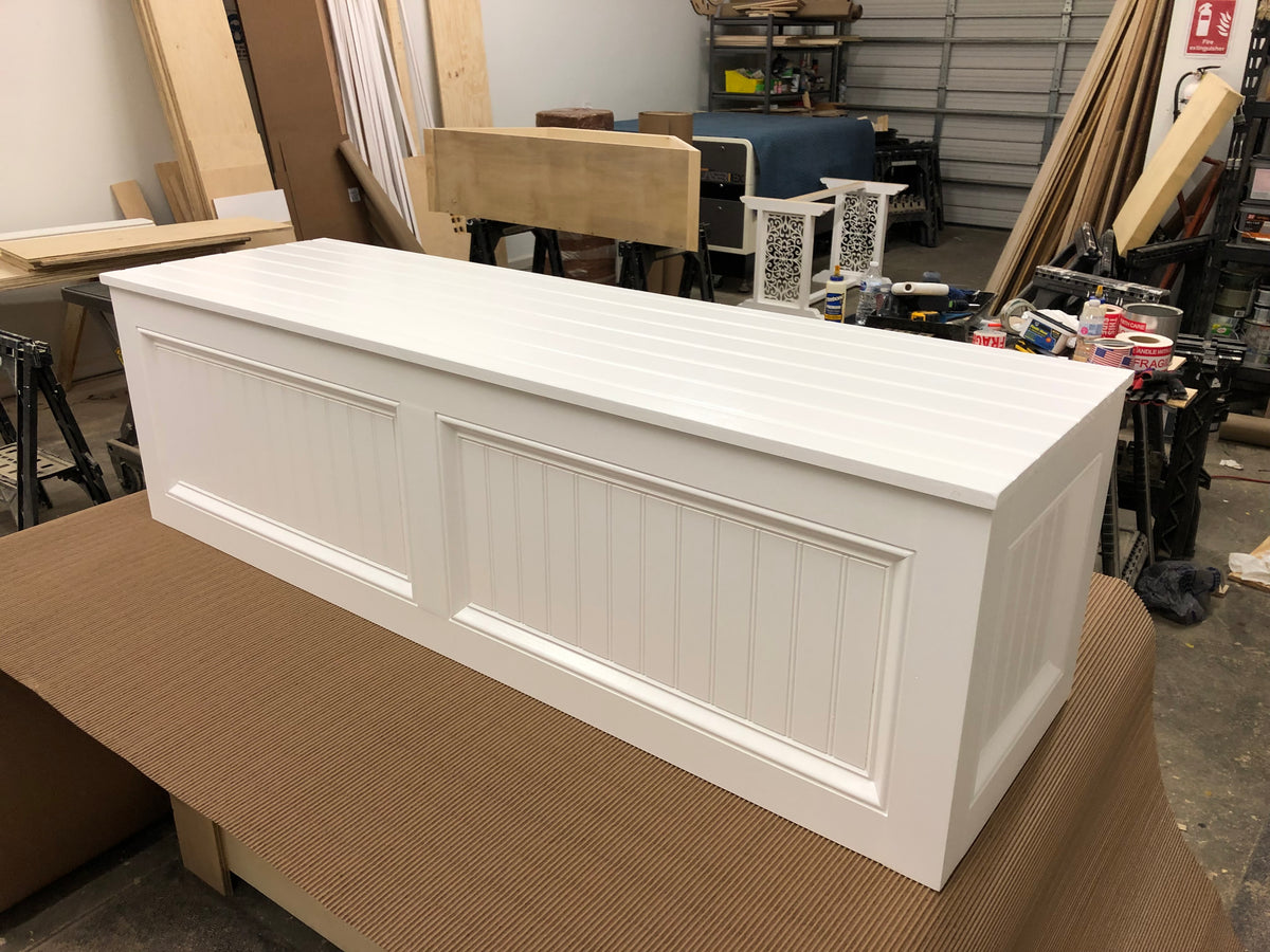 Photo of Traditional style straight bench painted all white on sides and top.