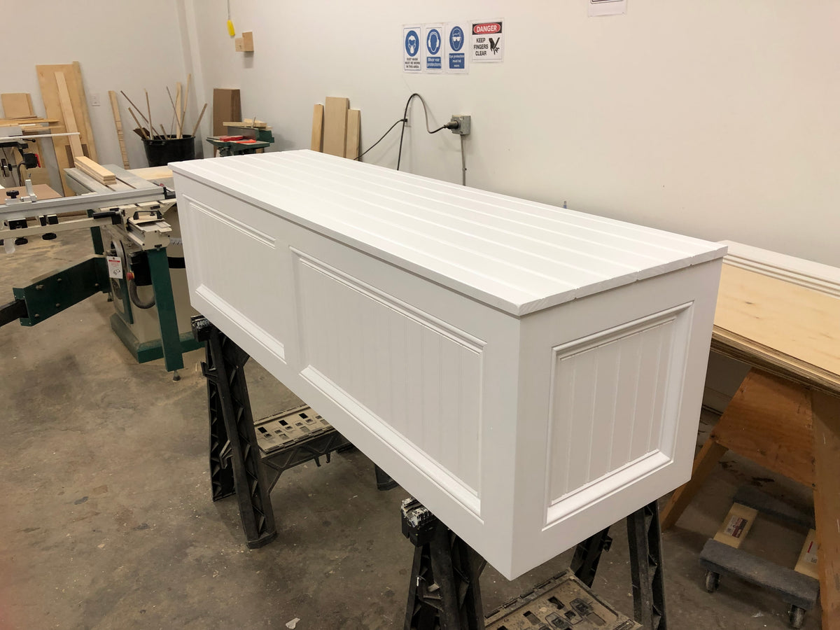 Photo of a straight bench without a baseboard heating accommodation. This bench sits flush to the wall.