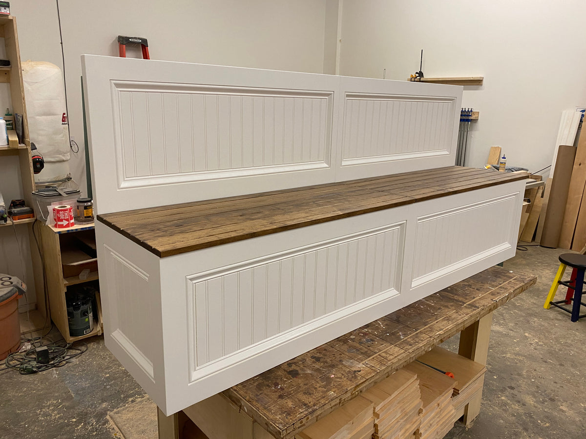Photo of Traditional style straight bench with backrest painted white with a wood-stain top