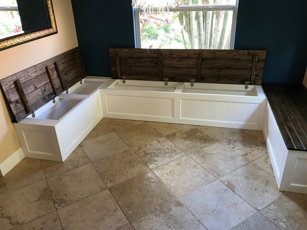Photo of a Traditional style U-shape bench painted white with tops open on two of three sides to show storage space