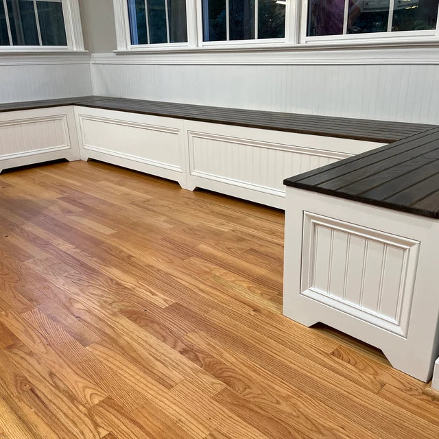 Photo of a Traditional style U-shape bench painted white with a dark brown V-groove top