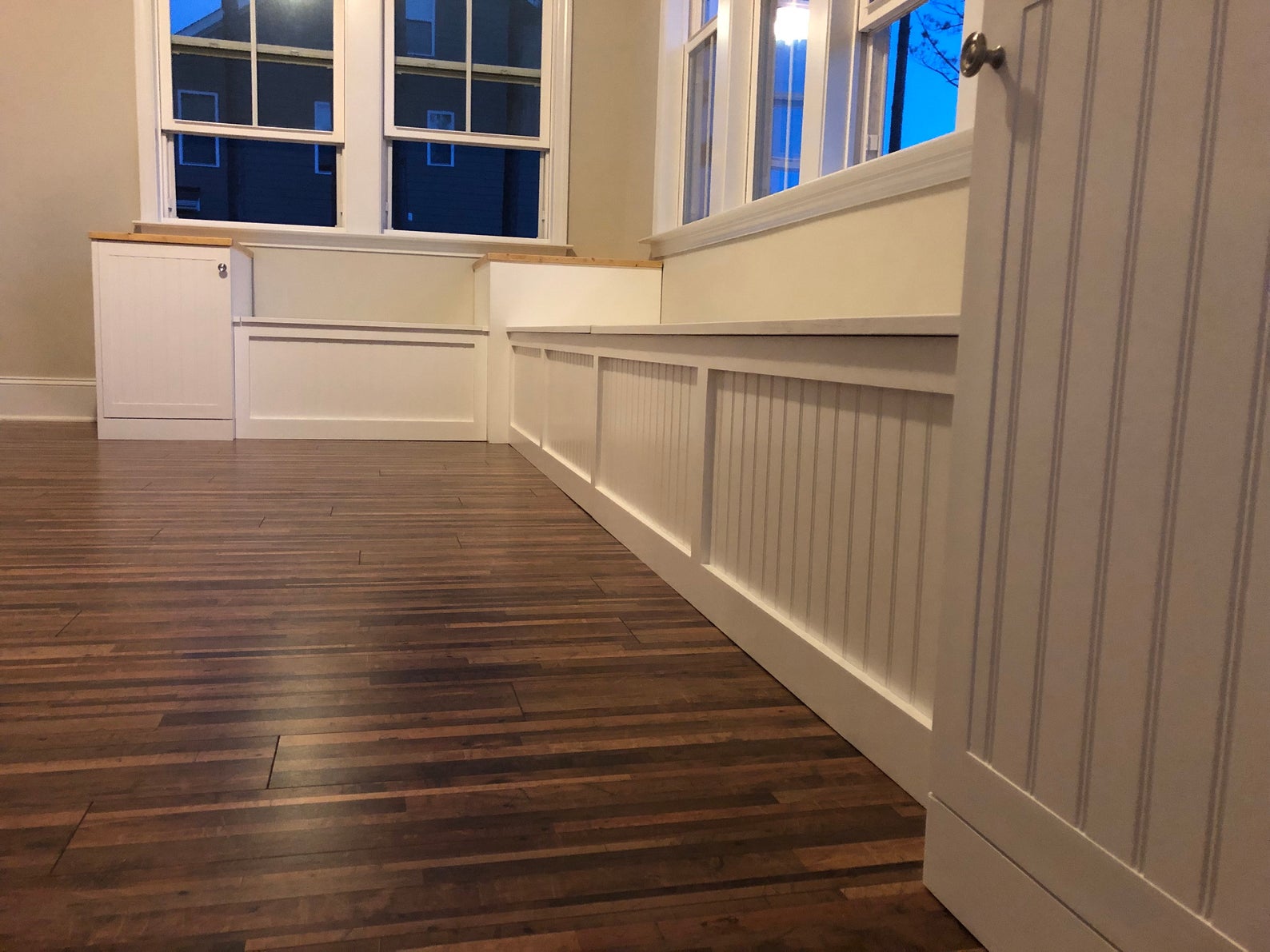 Photo of a Traditional style L-shape corner bench with custom raised end tables