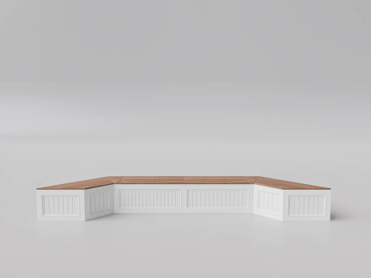 Custom window bench with white base, angled design, and natural wood top, built to fit bay window spaces with integrated storage.